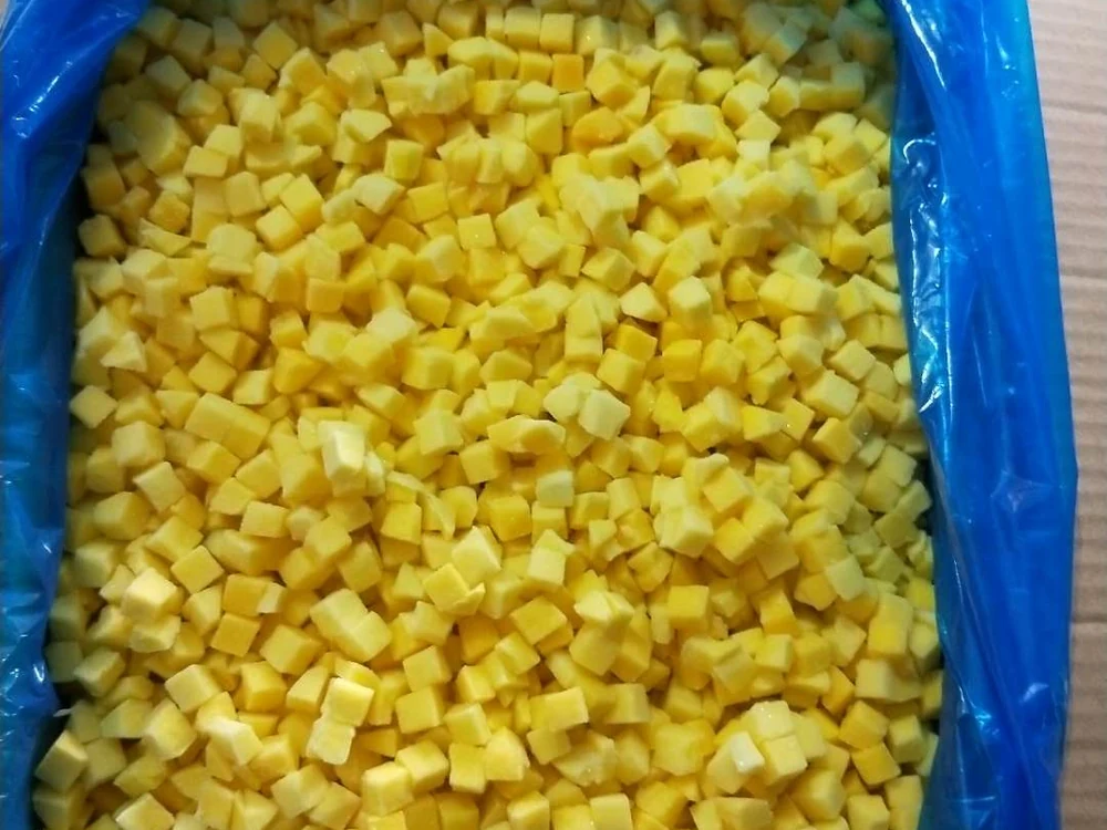 Original frozen mango dice for a product brief Frozen mango dice in a plain blue liner showing the cut to identify on an RFQ