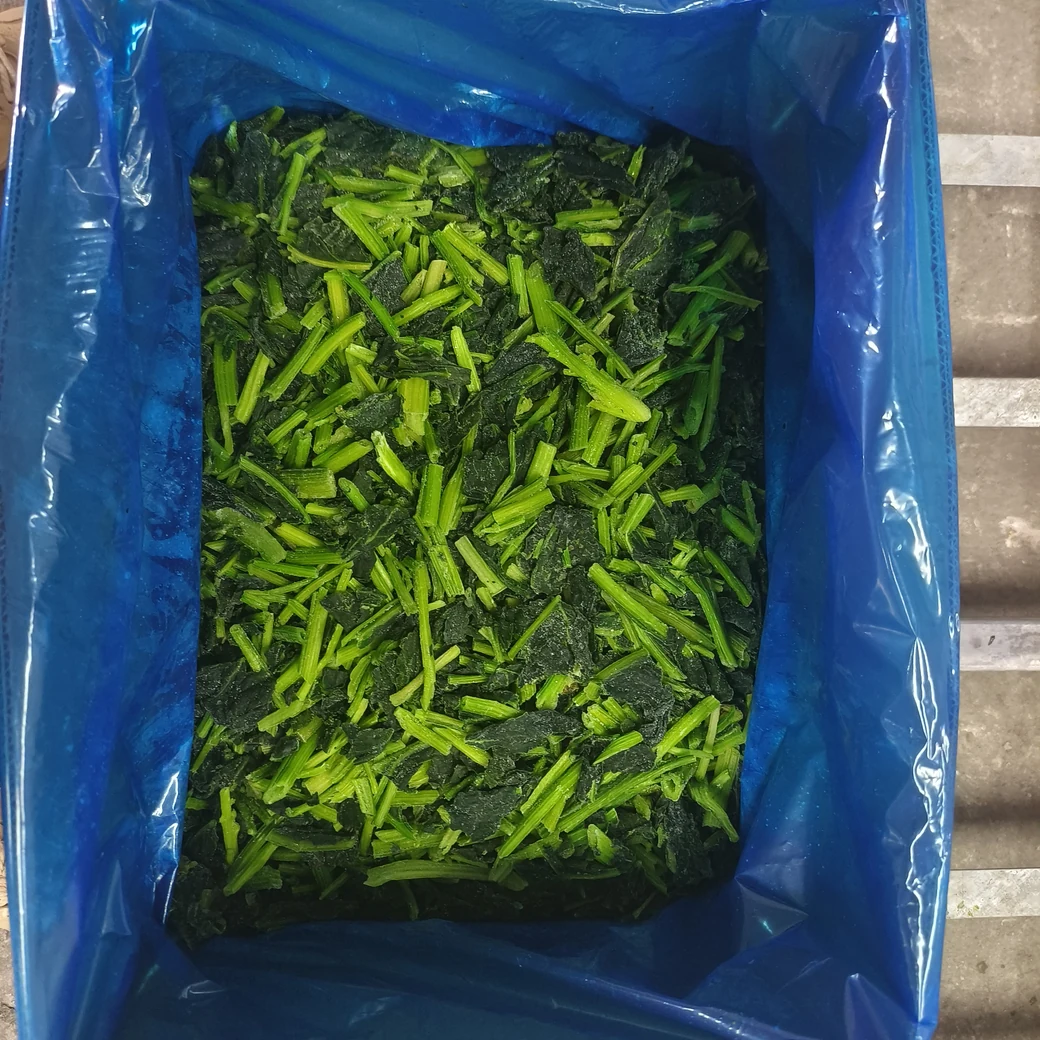 Include the actual liner and pack in the trial Original frozen leafy spinach material is held inside a blue liner in a rectangular bulk pack