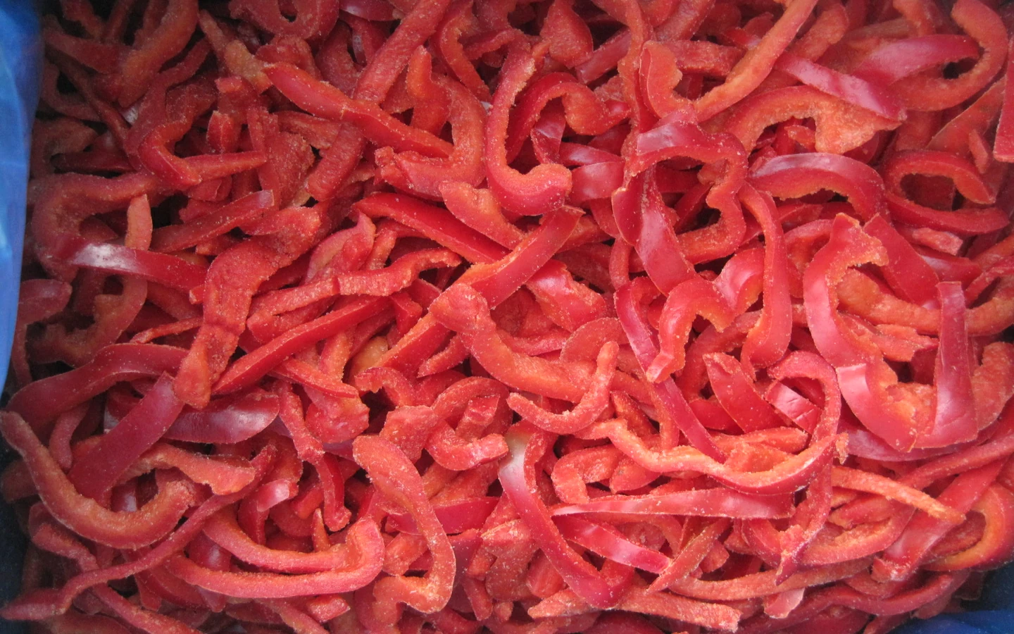 Frozen red pepper strip product reference Original frozen red sweet pepper strips in a blue liner