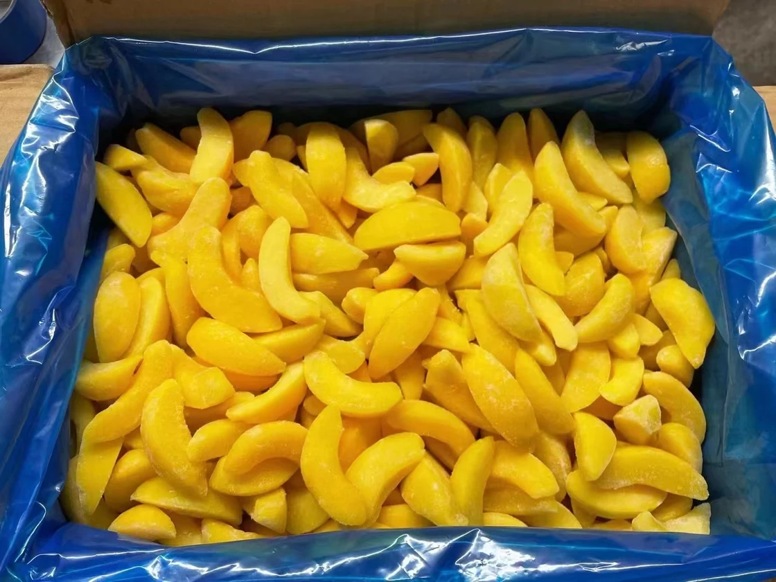 Separate slice presentation from measured defect requirements Frozen yellow peach slices lie in a blue carton liner, showing the sliced presentation discussed in the approval example
