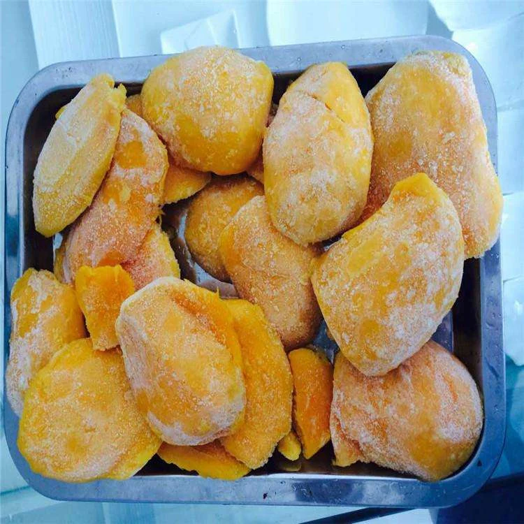 Mango cheek form Frost-covered mango cheeks arranged in a metal tray