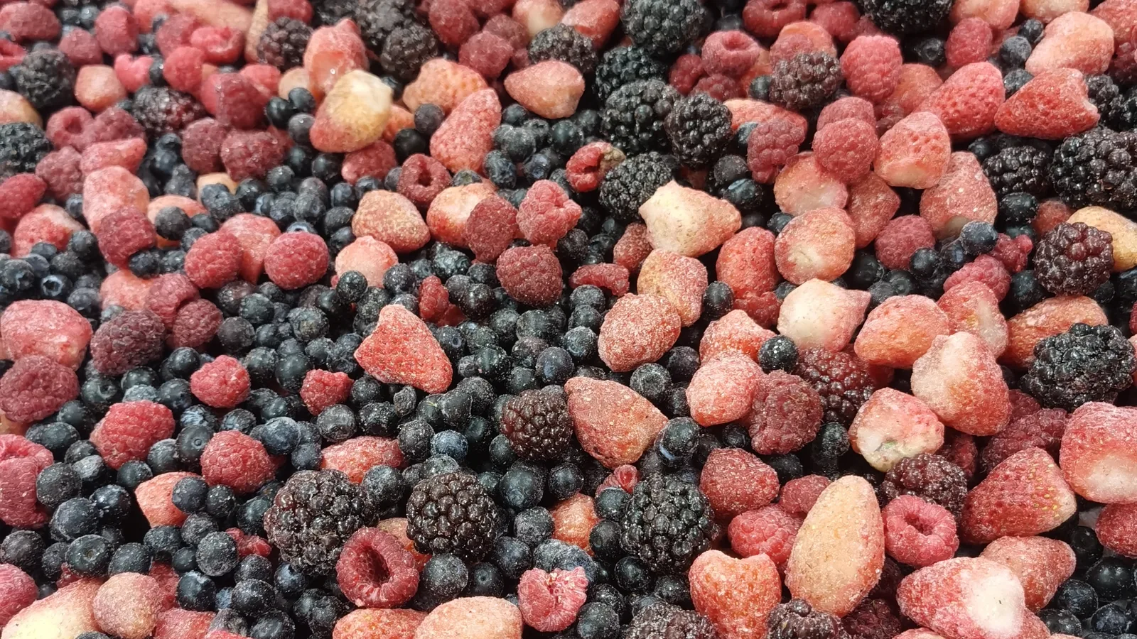 Berry solids available for a sauce Mixed frozen berry pieces in their original form