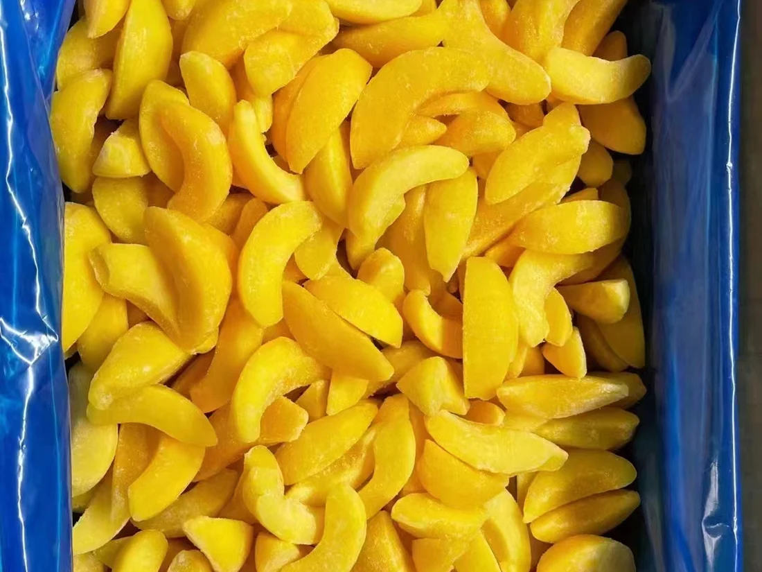 Frozen yellow peach wedges in a blue-lined container
