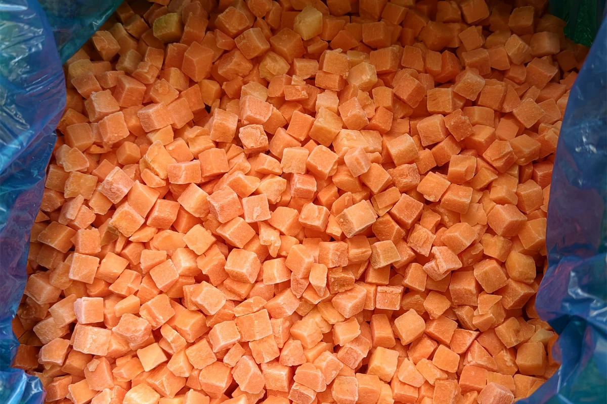 Diced carrots inside an open blue liner
